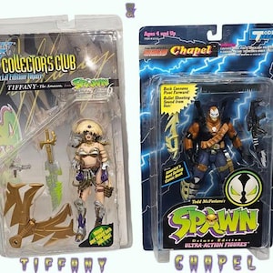 May include: Two action figure collectibles in original packaging. One is a Tiffany figure from the Collector's Club, and the other is a Chapel figure from the Spawn series. Both figures are in plastic packaging with colorful graphics.