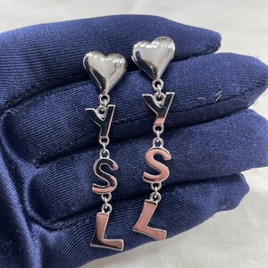 CHANEL FAMOUS ULTRA RARE PEARL, WOODEN HEART & CC LOGO EARRINGS