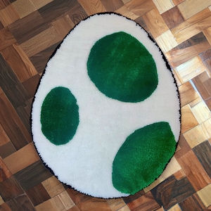 I made a tiny Yoshi egg rug to try burlap! : r/Tufting