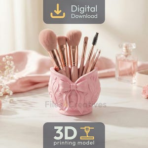 May include: A pink, bow-shaped makeup brush holder filled with various makeup brushes. The holder is decorated with floral details. The image also includes a perfume bottle, jewellery box, and roses, all in soft pink tones. The words "Digital Download" and "3D printing model" are visible.