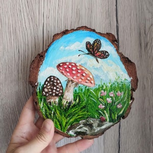 Small mushroom painted on round wood slice, autumn art. Painting on natural base, original painting, winter home decoration