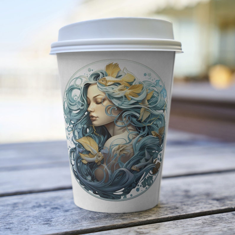 May include: A white paper coffee cup with a white lid. The cup features a circular illustration of a woman with flowing blue hair and gold fish accents. The design is set against a light blue and white background.