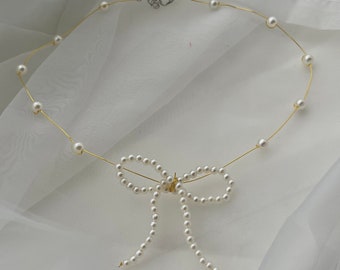 Handcrafted pearl bow necklace with copper wire