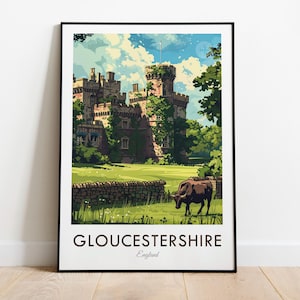 May include: Framed art print depicting a castle in Gloucestershire, England. The illustration shows the castle surrounded by greenery, a stone wall, and a cow grazing. The word "Gloucestershire" is printed at the bottom of the print.