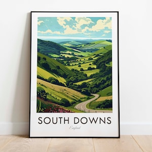 Peut inclure: Une affiche avec une illustration colorée d'une route sinueuse à travers une vallée verdoyante. Le texte "SOUTH DOWNS" et "England" est en bas de l'affiche.