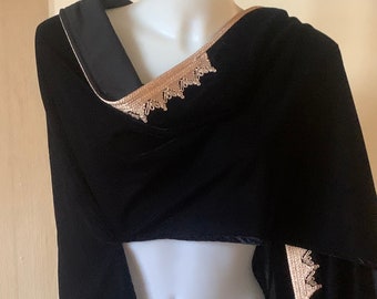 Hooded velvet cape.