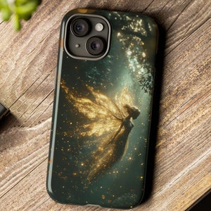 May include: A phone case with a dark green background and a golden fairy with wings flying through a starry night sky.