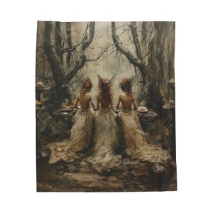 May include: Three fairies in white dresses with wings sit at a table in a dark forest setting. They are having tea and there are cakes on the table. The scene is magical and whimsical.