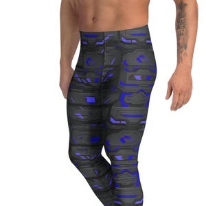 May include: Black and blue leggings with a geometric pattern. The leggings feature a repeating design of dark gray shapes with bright blue accents. The leggings are form-fitting and made of a stretchy material.