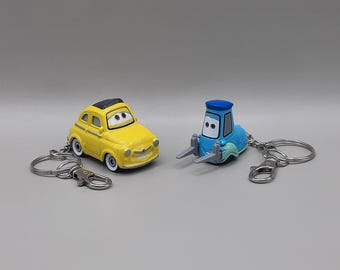 Llaveros de Luigi y Guido de CARS en caja de regalo, paquete de 2