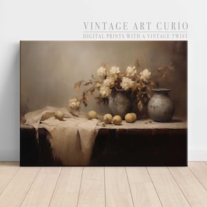 May include: A still life painting featuring a bouquet of white flowers in two ceramic vases, with a white cloth draped over a wooden table and several yellow apples scattered on the table.