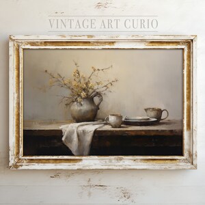 May include: A framed painting of a still life with a vase of yellow flowers, a pitcher, and three cups on a wooden table. The painting is in a white frame with gold accents.