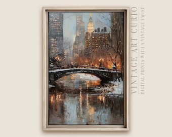 May include: A painting of a snowy cityscape with a bridge over a river. The buildings are lit up with warm lights, and the sky is a soft blue. The painting is framed in a silver frame.