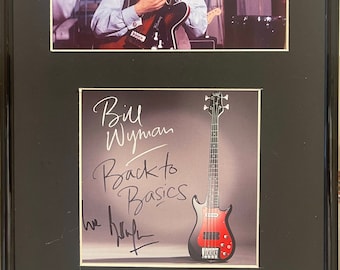 Bill Wyman, Rolling Stones Guitarist, 100% Guaranteed Hand Signed 'Back To Basics' CD Cover - With COA - Black Framed 12' x 9' inch.