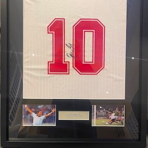 Simply Stunning Gary Lineker Hand Signed England Football Shirt In Black Frame (33&#39; x 25&#39;) with AFTAL Certificate of Authenticity (COA).