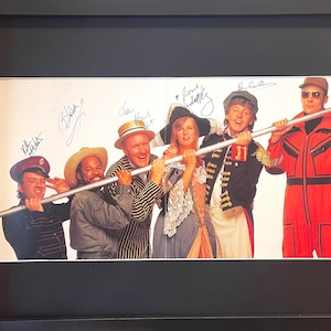 Paul McCartney And His Band (including Linda McCartney) 100% Guaranteed Hand Signed, Framed 'New World Tour' Programme 70cm X 50cm With COA.