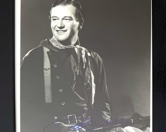 John Wayne - Stunning Genuine 100% Guaranteed Hand Signed 'Stagecoach' Publicity Photo. Framed 25x20cm & COA.