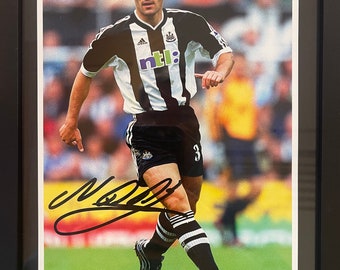 Nikos Dabizas - Ex Newcastle Utd Player - Genuine Hand Signed and Framed (10' inch X 8' inch) Photo - With Certificate Of Authenticity (COA)