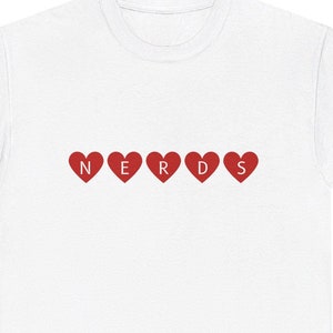 May include: White t-shirt with the word "NERDS" spelled out in red hearts.