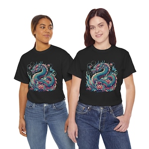 May include: Two people wearing black t-shirts featuring a colourful dragon graphic. The dragon is blue, green, pink and orange. The dragon is surrounded by flowers and leaves.