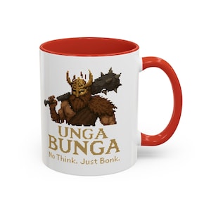 May include: White ceramic mug with a red rim and handle. The mug features a pixelated illustration of a warrior with a helmet and a club, along with the text "UNGA BUNGA No Think. Just Bonk."
