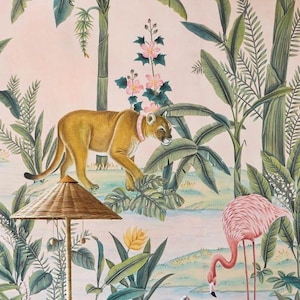 May include: A wallpaper design depicting a cougar with a pink collar, a pink flamingo, and tropical plants. The background is a soft pink, with a woven lamp and a water scene. The artwork evokes a jungle theme.