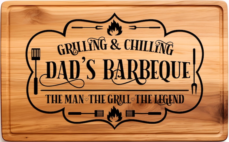 May include: A wooden cutting board with a black engraved design that says "Grilling & Chilling Dad's Barbeque The Man - The Grill - The Legend".