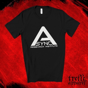 May include: A black short-sleeved t-shirt featuring a white graphic on the chest. The graphic displays a large stylized letter A above the text ASYNC and the words RESEARCH INSTITUTE in a smaller font underneath the main logo design.