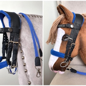 May include: A black leather bridle with bright blue fleece padding on the crown piece and noseband. The browband features a row of small clear crystals. The bridle includes silver-toned metal buckles and a long blue nylon lead rope with a metal clip.