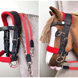May include: A black leather horse bridle featuring bright red fleece padding on the crown piece and noseband, a browband with embedded crystals, silver-toned metal buckles, and a pair of long red nylon reins with metal swivel snap hooks.