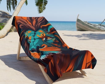 May include: A beach towel with a colorful lion face design. The towel is folded and placed on a wooden beach chair. The chair is on a sandy beach with palm trees and a wooden boat in the background.