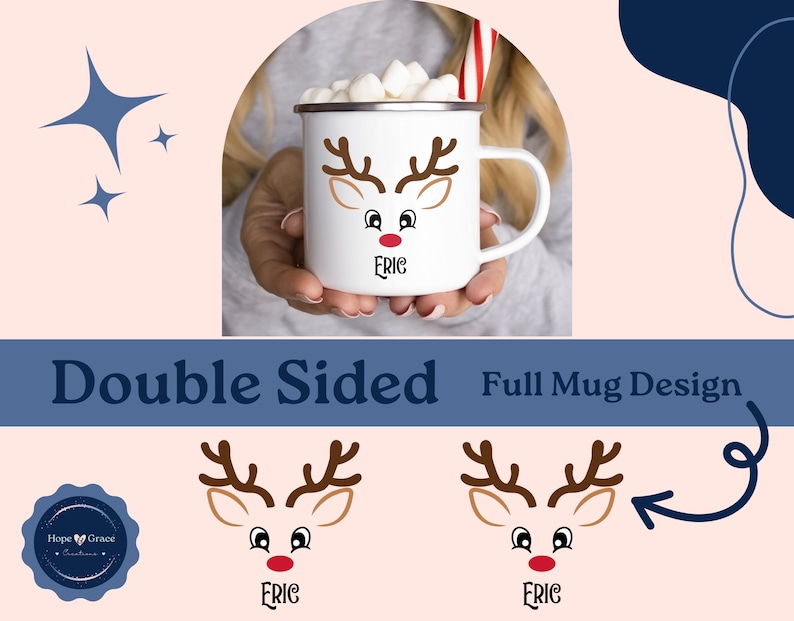 May include: White ceramic mug with a reindeer face design. The reindeer has brown antlers, brown eyes, and a red nose. The mug has the name "Eric" written below the reindeer face. The mug is shown being held by a person's hand.
