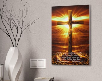 Canvas Stretched, Cross in front of the Ocean, with the sun setting in the background.