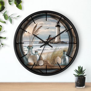 May include: A black clock with a white lighthouse, seashells, and driftwood on a beach scene. The clock face is white with black hands.