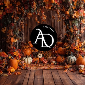 May include: A fall-themed backdrop with a wooden background and a circle logo with the text "ATDSCRAFT AD" in white. The backdrop is decorated with fall leaves, pumpkins, and gourds.