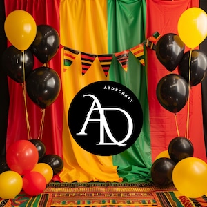 May include: A colorful backdrop with red, yellow, and green fabric panels. A black circle with the letters "AD" in white is in the center of the backdrop. Black and yellow balloons are arranged in front of the backdrop.