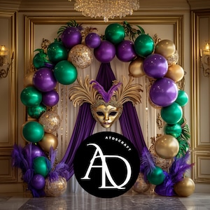 May include: A purple and green balloon arch with gold accents and a gold masquerade mask hanging in the center. The arch is decorated with feathers and the text "ATDSCRAFT AD" is visible in the lower center of the image.