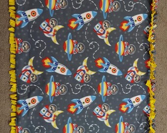 Rocket ships, Sloth Astronauts...Great stadium blanket. Perfect for camp outs, movie nights or nap time.