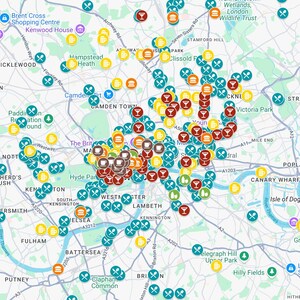 May include: A detailed map of London, densely populated with icons representing food and drink establishments. Symbols include cutlery, wine glasses, burgers, and beer glasses, indicating restaurants, pubs, and cafes. The map shows major roads and areas.