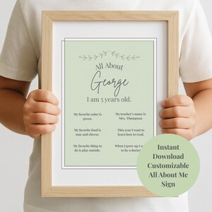 May include: A framed, light green "All About Me" sign with the name "George" in cursive. The sign includes the text "I am 5 years old" and other details. A circular sticker on the bottom right says "Instant Download Customizable All About Me Sign."