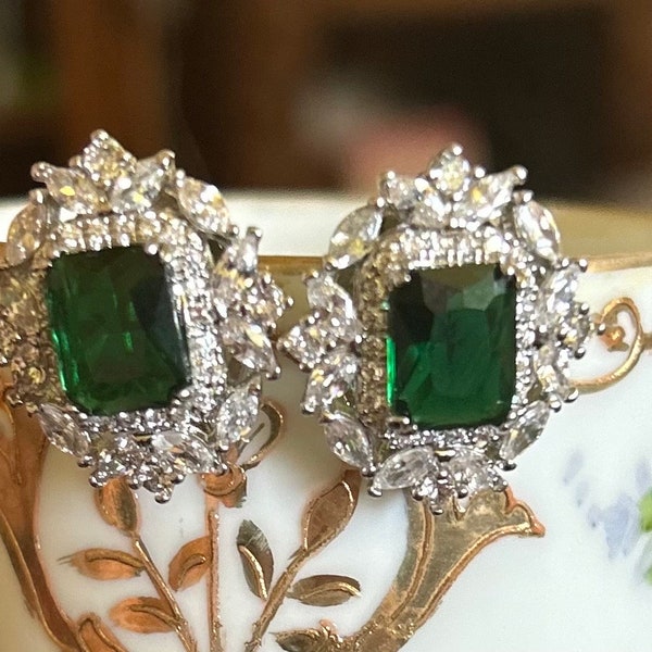 Fit for a queen, gorgeous sparkling faux emerald and crystal rhinestone earrings. Vintage inspired glamour for the diva in your life.