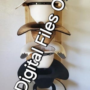 May include: A wooden hat rack with five hats hanging on it. The rack has a quote from Corinthians 11 written on it. The hats are a variety of colors and styles.