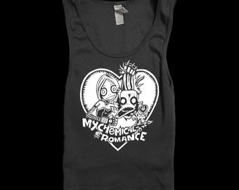May include: A black sleeveless tank top featuring a white graphic print of two stylized cartoon characters inside a heart shape. Below the characters, the text reads My Chemical Romance with a small skull and crossbones icon underneath the lettering.