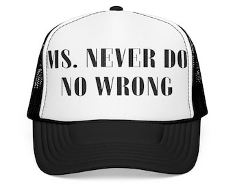 May include: A black and white trucker hat with the text "MS. NEVER DO NO WRONG" printed on the front. The hat has a black brim and mesh back, with a white front panel.