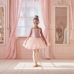 May include: A young ballet dancer in a pink tutu and leotard stands in a sunlit room. The dancer's hair is styled in a bun, and she wears ballet shoes. The room features pink curtains, a window, and mirrors, creating a soft, elegant atmosphere.
