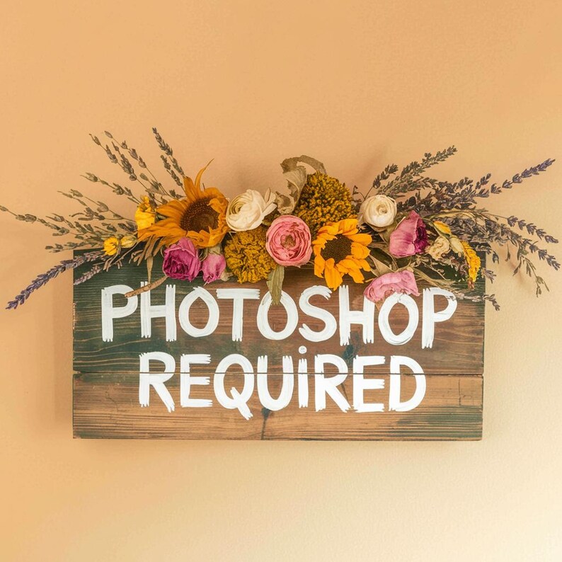 May include: A rustic wooden sign with the text "Photoshop Required" painted in white. The sign is decorated with dried flowers, including sunflowers, lavender, and pink roses.