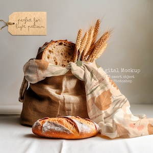 May include: A brown burlap sack filled with loaves of bread and wheat stalks. The sack is decorated with a beige fabric with a brown and green leaf pattern. The text "perfect for light pattern" is written on a brown tag.