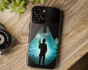 May include: A black smartphone case featuring a silhouette of a person holding a blaster inside a blue and teal nebula-filled shape of a spaceship. The design includes a starry background and a dark landscape at the bottom of the central graphic.