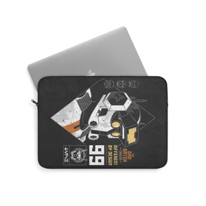 May include: Black laptop sleeve with a white and gray robot head graphic. The text "The Bad Batch" is above the robot head, and the text "Different by Design" is below the robot head. The number "99" is in the bottom right corner.