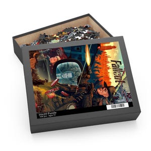 May include: A 16x20 inch puzzle box with a Fallout-themed image. The box is open, revealing the puzzle pieces and the completed image. The image features a futuristic cityscape with characters and the word "Fallout".